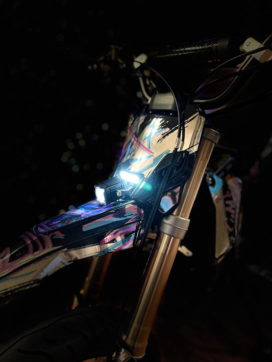 Close-up of a Surron Hyper Bee headlight upgrade