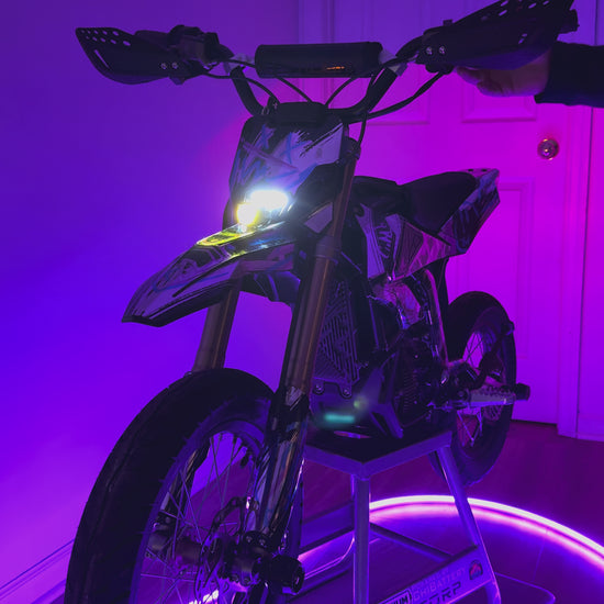 Short video showcasing the upgraded Surron Hyper Bee Headlight functions. Purple LEDs and Red lights are filling the video with colors.